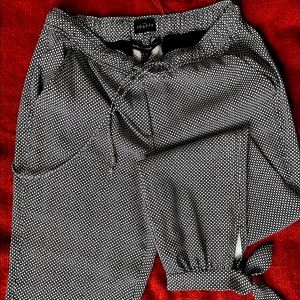 Black & White Joggers with Drawstring waist and Ties around the ankle. WHBL